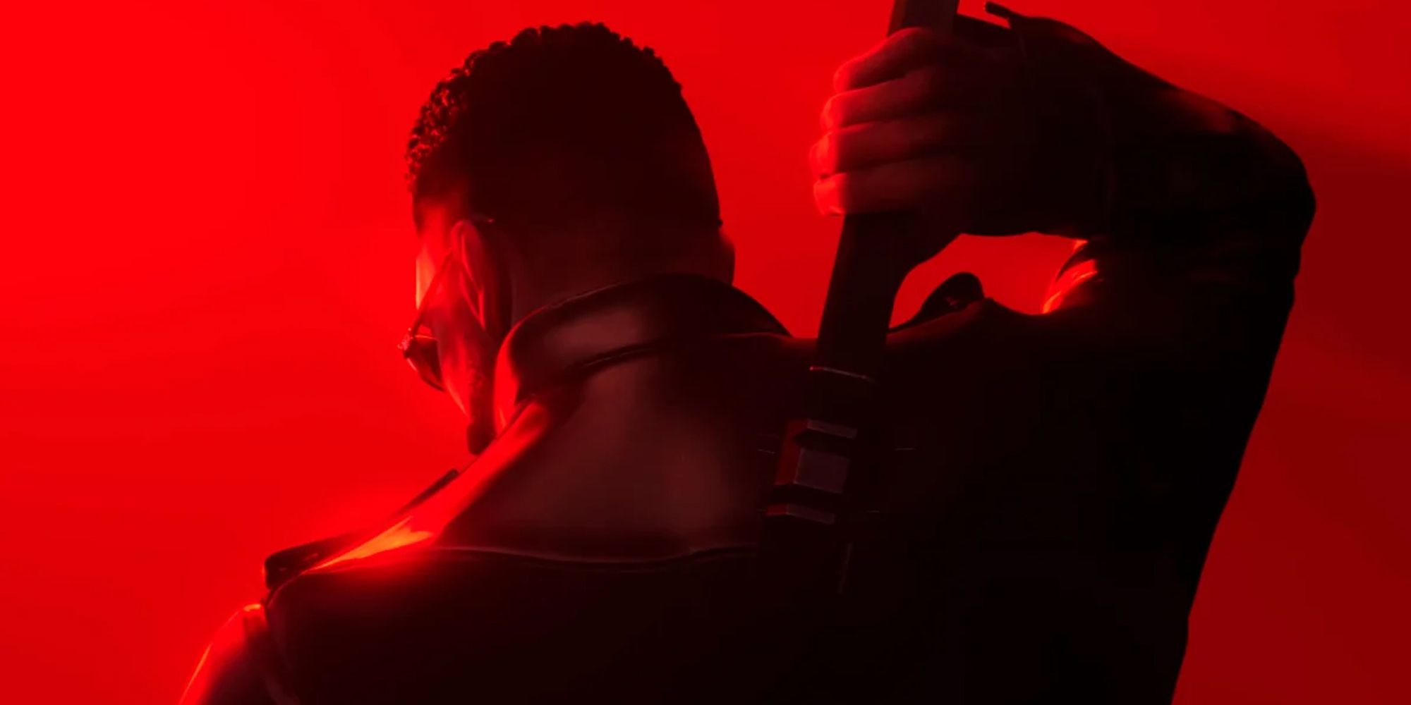 blade from arkanes new game with his back turned over a red background